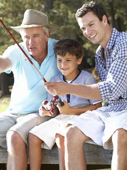 A grandfather, father and son fishing together — three generations of one East Greenwich family.
